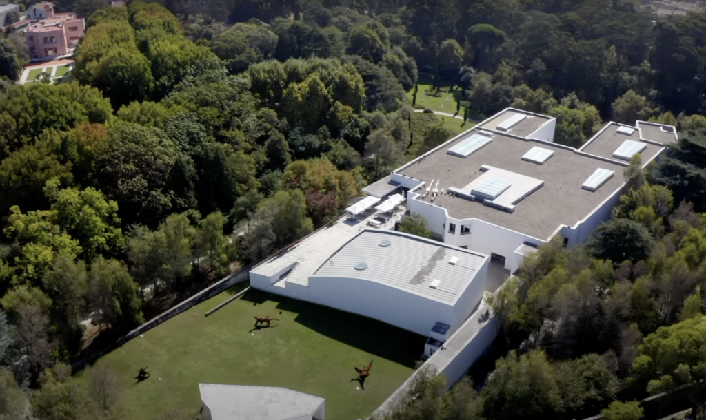 Modern architecture of the Serralves Museum in Porto, surrounded by lush green gardens